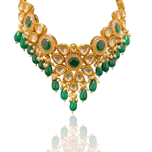 tatement Necklace Set with Green Stones | Festive Wear Necklace for Special Occasions | Luxurious Jewelry with Antique Finish | Designer Kundan Necklace Set | South Asian Bridal Accessories | Traditional Indian Necklace for Engagements, Mehndi, and Sangeet | Heirloom Quality Jewelry | Ideal for Ethnic Outfits and Sarees | High-Quality Craftsmanship | Emerald Green Necklace for Regal Look | Exclusive Jewelry Set with Matching Earrings | Perfect Gift for Brides and Jewelry Lovers | 