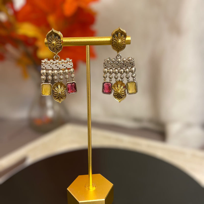 Dualtone gold and silver Indian earrings with red and yellow stones.