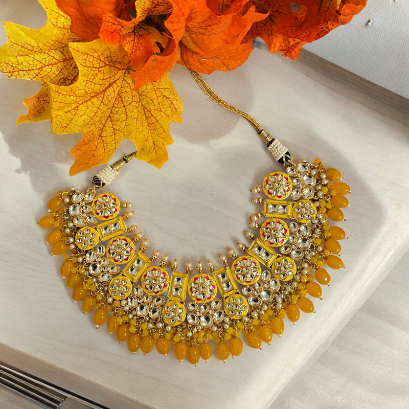 Sabyasachi inspired necklace set with earrings and maang tikka. Yellow kundan necklace with pearls, hand painted meenakari and yellow beads. Statement yellow necklace set. Designer jewelry. Desi jewelry.