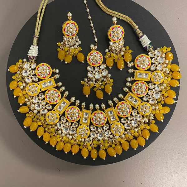 Yellow Kundan Necklace Set with pearls and hand painted meenakari. Sabyasachi inspired necklace set. Statement Necklace Set. Yellow kundan necklace set with earrings and maang tikka. Manish Malhotra necklace set. Sabyasachi jewelry.