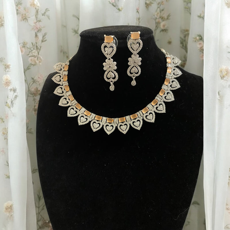 Elegant peach CZ necklace set adorned with shimmering cubic zirconia stones and matching earrings. A timeless design ideal for weddings, parties, or festive celebrations. Lightweight and hypoallergenic, it effortlessly enhances your style.