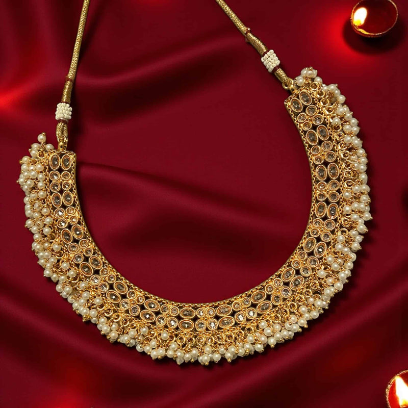 South Indian Guttapusalu necklace crafted with premium Polki stones and dense pearl bunches in antique gold finish. Signature temple jewelry style with a detailed pearl fringe. Ideal for bridal wear, weddings, photoshoots, and cultural celebrations. Elegant Polki and pearl design inspired by traditional Andhra and Tamil jewelry artisans.