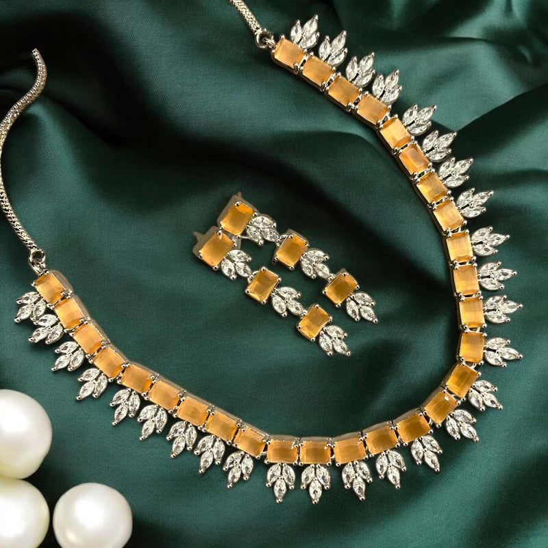 Peach necklace set with premium American diamonds and peach beads. Elegant design for weddings, parties, and festive occasions. Includes matching earrings for a complete look. High-quality South Asian jewelry perfect for brides and modern women.