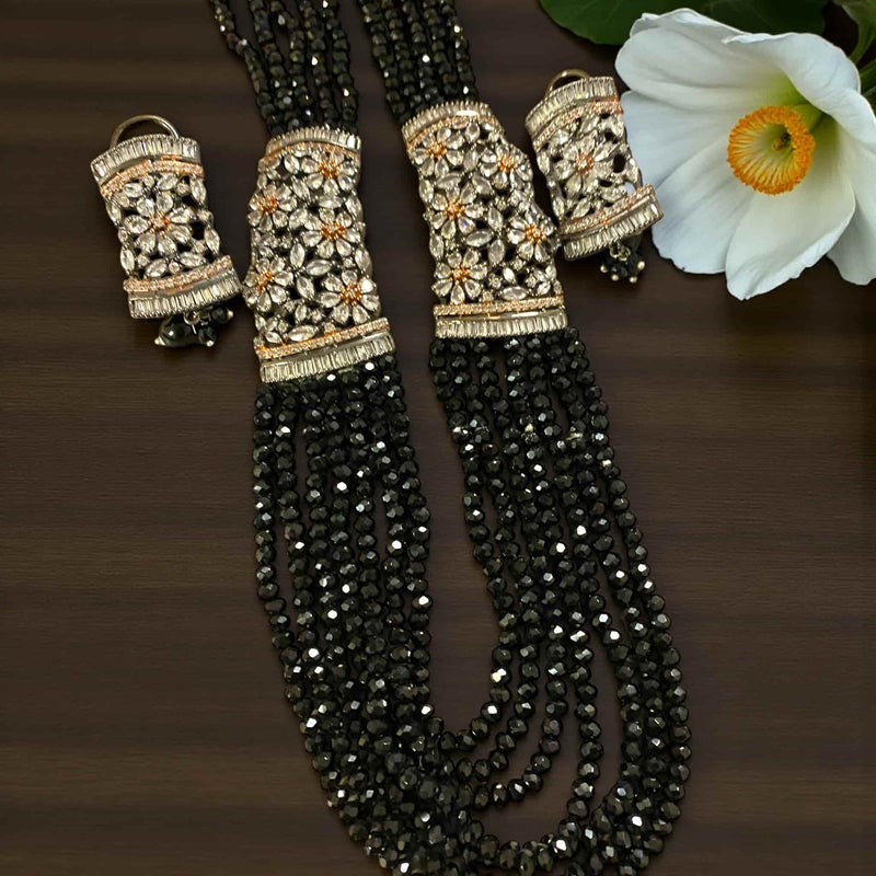 Elegant Black Pearl Mahima CZ Long Necklace Set with CZ Flowers | Long gold-plated necklace with lustrous black pearls and dazzling cubic zirconia floral designs | Comes with matching earrings | Perfect for weddings, receptions, and festive celebrations | Handcrafted Indian jewelry by Romikas | Classic and contemporary fusion design adding regal beauty and refinement to any outfit