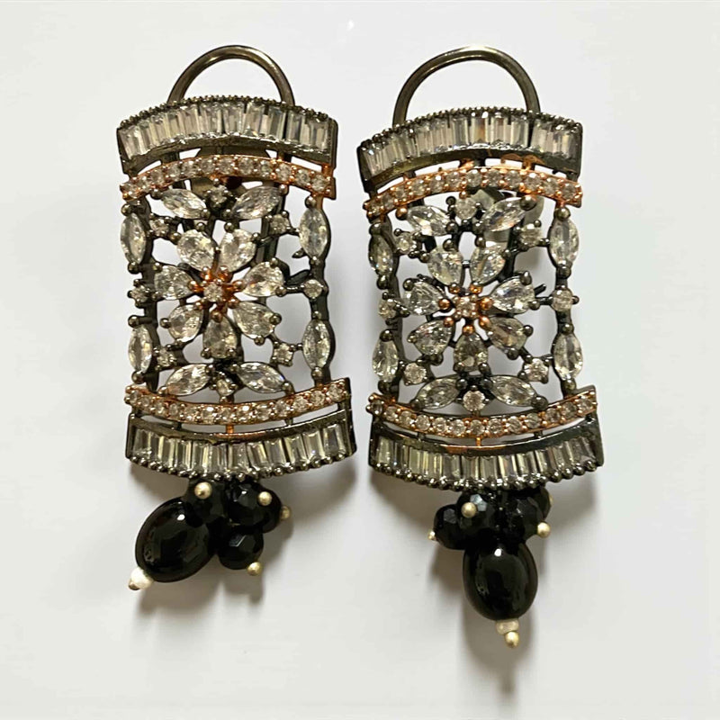 Elegant Black Pearl Mahima CZ Earrings with CZ Flowers | Indian jewelry with glossy black pearls and radiant cubic zirconia detailing | Gold-plated floral design offering a luxurious finish | Perfect for bridal wear, receptions, and festive celebrations | Lightweight, versatile, and beautifully handcrafted by Romikas Jewelry | A statement accessory exuding classic elegance and refined charm