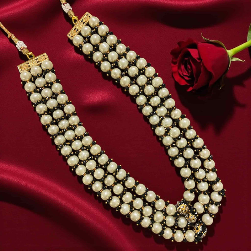 Flat-lay image of the Fatiha Long Pearl Necklace with Earrings, a multi-layer Indian pearl mala made with ivory pearls, black beads, Kundan stones, and Meenakari gold-plated detailing. The necklace is displayed on rich red satin beside a red rose, showcasing traditional Indian bridal and festive jewelry perfect for weddings, parties, and ethnic fashion.