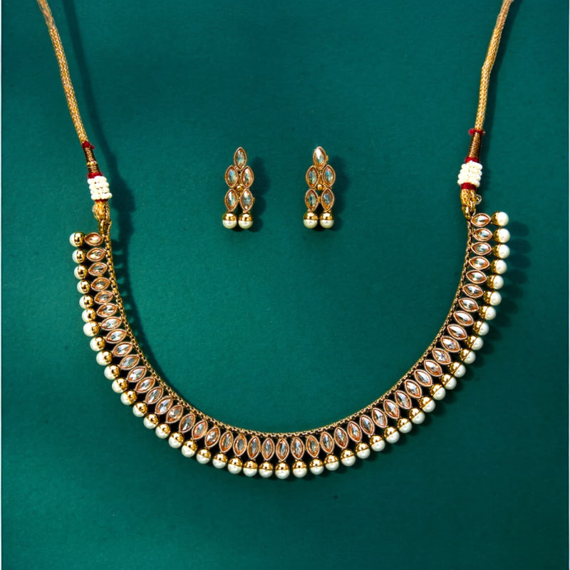 Indian Polki Necklace Set with Pearls for a simple, elegant look.