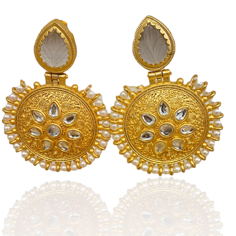 Gold Earrings with embeded kundan and an out layer of pearl. The top has a grey amrapali stone.