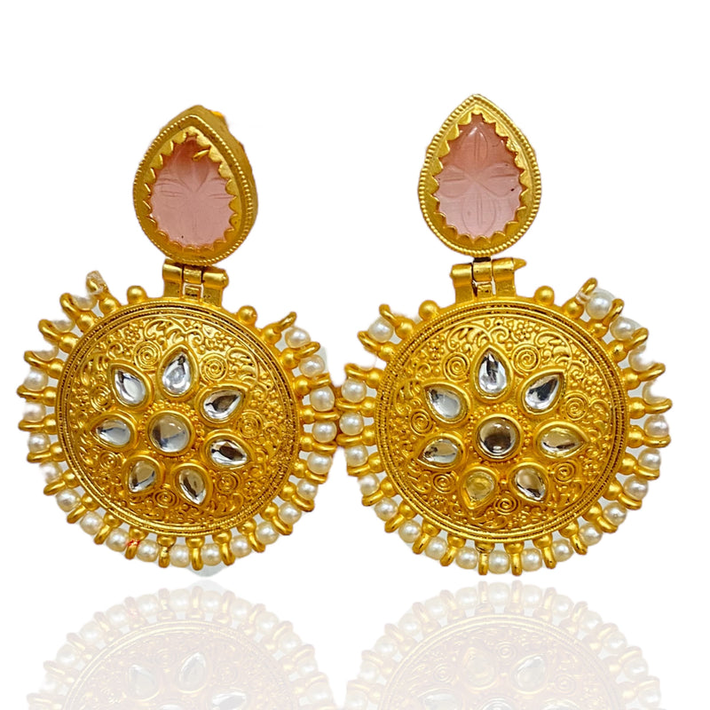 Elevate your style with our exquisite Gold Kundan Earrings, a true reflection of Desi charm and Pakistani jewelry finesse. Gold plated brass earrings with embedded kundan, a layer of pearl and amrapali stone.
