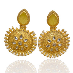 Gold plated kundan earrings with a layer of pearls and yellow amrapali stone.
