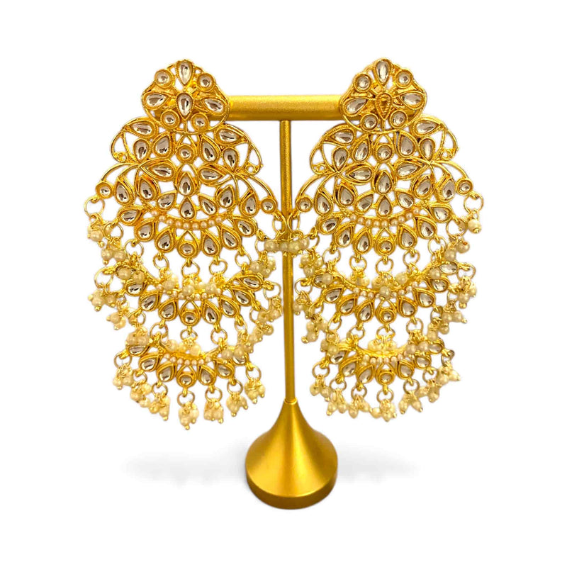 High quality gold plated Kundan chandbali earrings with intricate stonework and delicate pearl drops. Traditional Indian jewelry design perfect for bridal wear, weddings, festivals, and ethnic outfits. Premium handcrafted Kundan earrings with rich gold finish.