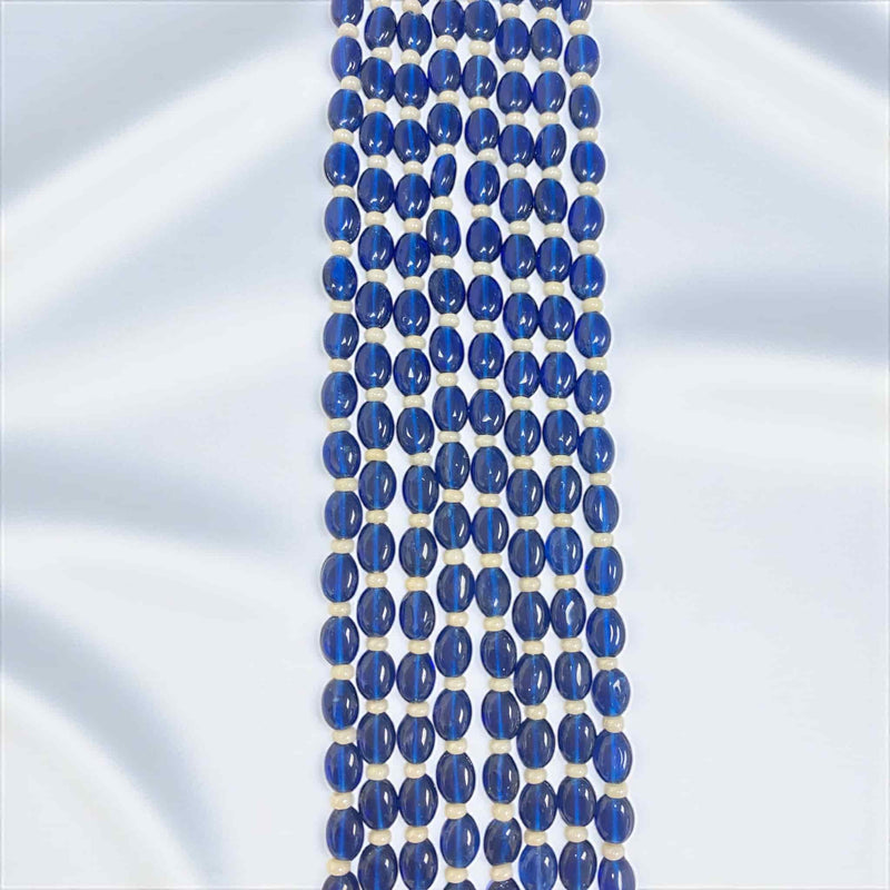 Royal Blue Monalisa Beads Necklace Set featuring layered blue beads that radiate elegance and luxury. These glossy beads beautifully complement the Kundan and Polki pendant with silver foil back meenakari work. Perfect for Indian weddings, bridal wear, and festive occasions, the multi-strand design enhances the regal gold-plated finish, adding depth and sophistication to traditional jewelry. Ideal statement set for sarees, lehengas, and ethnic outfits.