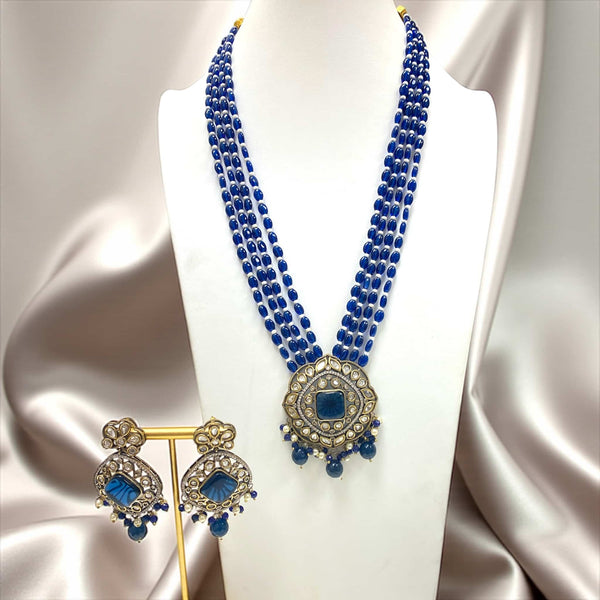 Royal Blue Kundan Necklace Set with Earrings featuring intricate Kundan and Polki work, blue Monalisa beads, and silver foil back meenakari detailing. Elegant Indian bridal jewelry set in gold finish, perfect for weddings, festive occasions, and traditional events. Includes multi-strand blue bead choker necklace and matching statement earrings for an ethnic royal look.