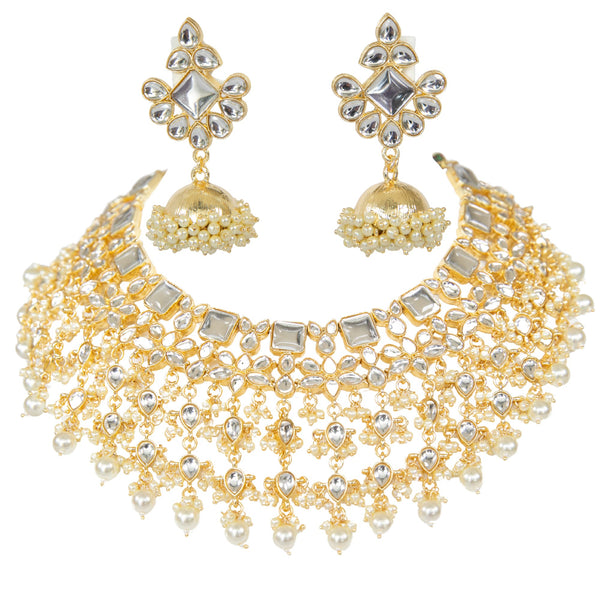 Indian Jewlery featuring a four layer kundan necklace set with jhumka earrings.