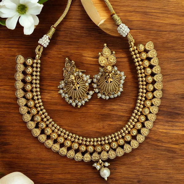 Gold necklace with pearls and matching jhumka earrings, traditional Indian jewelry set for women. Gold-plated design with intricate detailing, perfect for weddings, festivals, and ethnic outfits like sarees and lehengas. Elegant bridal necklace set with classic pearl accents and statement jhumkas. Ideal South Asian jewelry for special occasions.