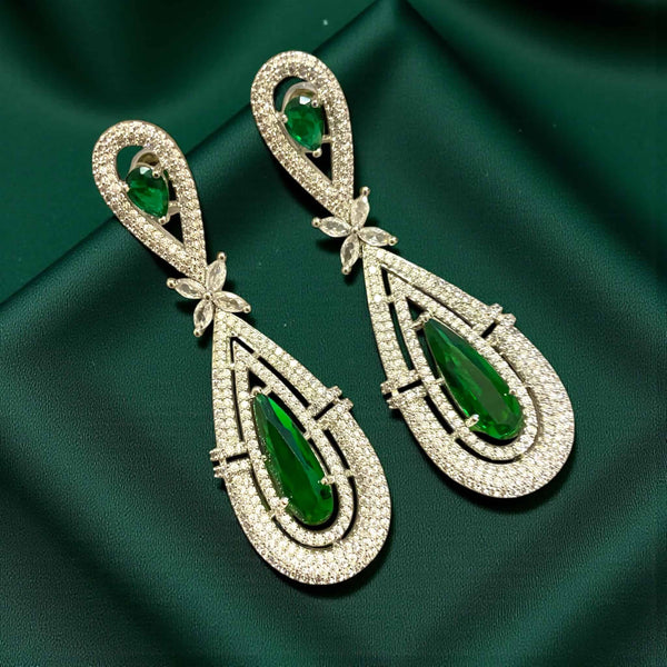 Premium American diamond earrings with emerald green stones, long CZ dangle design, elegant Indian wedding and festive jewelry.”