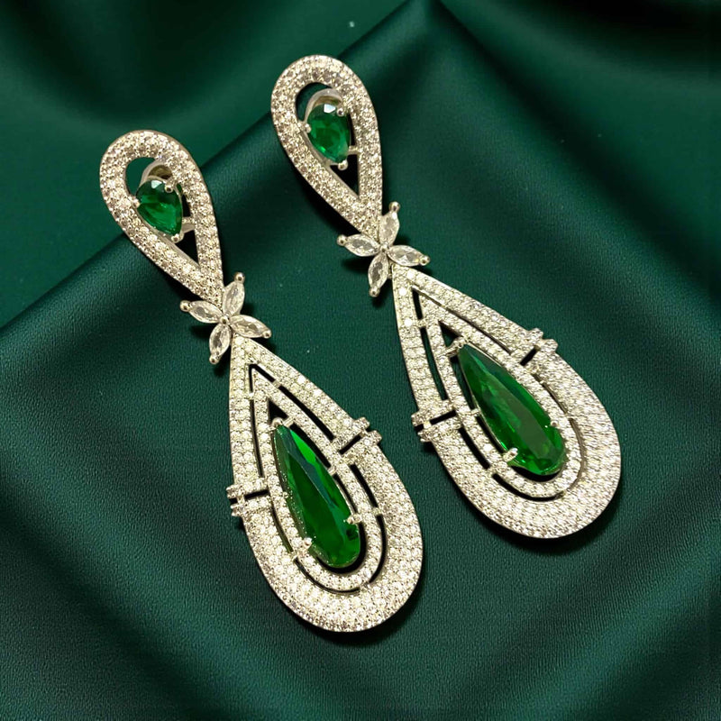 Premium American diamond earrings with emerald green stones, long CZ dangle design, elegant Indian wedding and festive jewelry.”