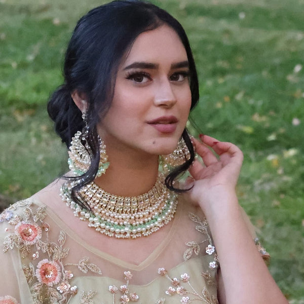Model wearing Indian Jewelry Necklace Set with kunan, mint and pink beads and pearls.