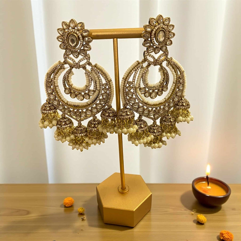 Kundan and pearl gold plated chandbali earrings with floral Kundan design and pearl drops, handcrafted Indian jewelry perfect for weddings and parties.