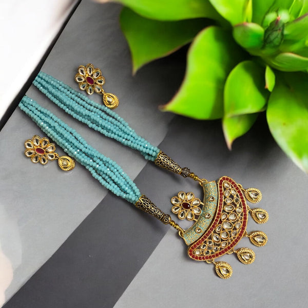 Sky blue long necklace set with Kundan, meenakari, and pearls | Indian jewelry | South Asian necklace featuring blue bead strands, gold plating, and intricate details | Includes matching earrings | Perfect for weddings and festive occasions |