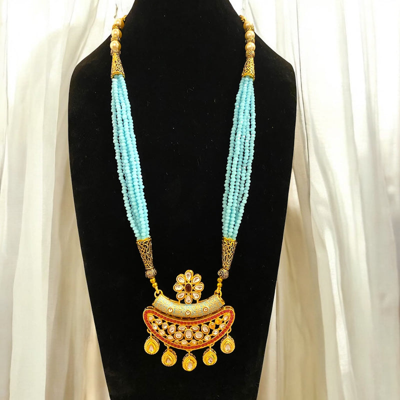 Multilayered Blue Mala with kundan and ruby beads. Long Blue Mala with kundan and red stones.