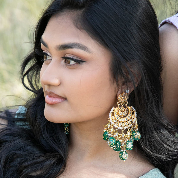 Model Wearing Green Kundan Chandbali Earrings with Pearls | Traditional Indian Bridal Jewelry | Handcrafted Kundan Earrings with Intricate Detailing | Hand-Painted Tanjore Beads | Elegant South Asian Accessories for Weddings and Festive Occasions | Ethnic Jewelry |