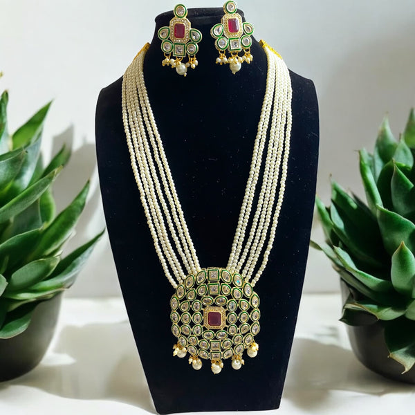 Pearl Long Necklace Set with Kundan and CZ. Set comes with earrings featuring Indian Jewelry Online. This multilayered Pearl Long Necklace Set features a ruby stone in the middle.