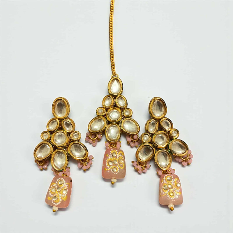 Elegant Kundan earrings and matching maang tikka set with pink Monalisa beads and intricate back meenakari work, gold-plated finish, traditional Indian jewelry design. Perfect for weddings, bridal wear, festivals, and ethnic occasions, this premium accessory set showcases exquisite craftsmanship, vibrant beads, and timeless South Asian style, ideal for completing bridal and festive looks with elegance and cultural charm