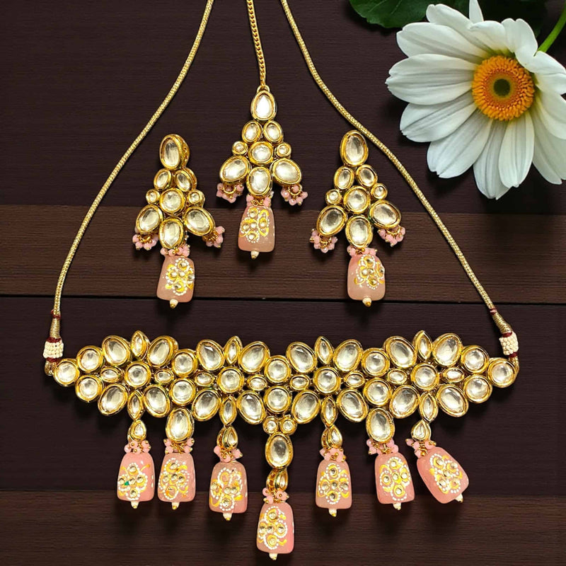 Elegant Pink Kundan Choker Necklace Set with Back Meenakari, featuring a handcrafted gold-plated choker adorned with shimmering Kundan stones and soft pink Monalisa beads. Includes matching earrings and maang tikka, perfect for Indian bridal jewelry, South Asian weddings, and festive occasions. This traditional Meenakari Kundan set adds a royal touch to sarees, lehengas, and anarkalis, combining timeless craftsmanship with modern elegance.