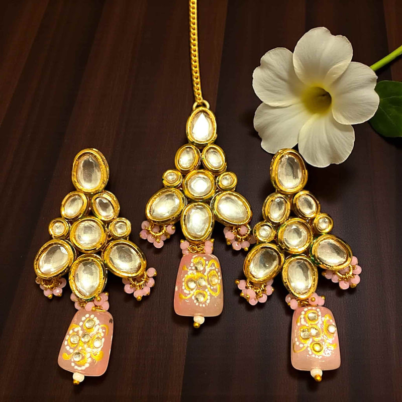 Stunning Kundan earrings and maang tikka set featuring pink Monalisa beads with intricate back meenakari work, gold-plated finish, reflecting traditional Indian jewelry craftsmanship. Ideal for weddings, bridal events, festivals, and ethnic occasions, this elegant set combines premium quality, vibrant beads, and detailed design, making it a perfect accessory to enhance South Asian bridal and festive attire with sophistication and timeless charm