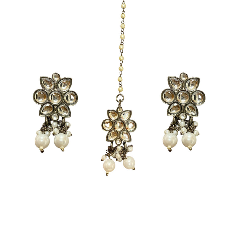 Earrings and Tikka Set in Kundan with Pearls in victorian black polish.