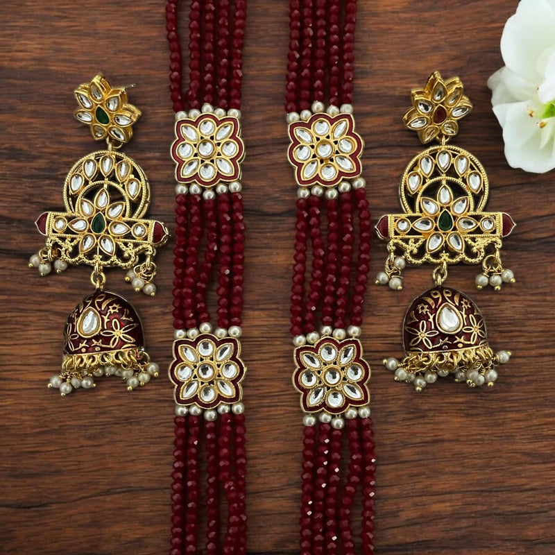 Pritha Maroon Kundan long necklace set with intricate meenakari work, gold-plated details, and delicate pearls. This handcrafted South Asian jewelry set includes matching earrings and is perfect for festivals, traditional events, and special occasions. Featuring rich maroon beads and fine Kundan craftsmanship, it adds elegance and sophistication to any ethnic or formal outfit. A timeless piece for those looking to enhance their collection with luxurious and detailed jewelry.