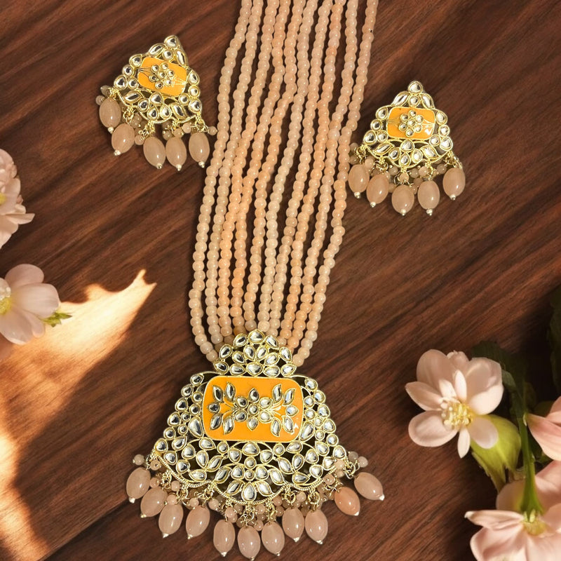 Long gold-plated Kundan necklace set with peach beads and matching earrings | Elegant Indian jewelry for weddings and festive events | Intricate Kundan craftsmanship | Statement necklace set for traditional outfits like sarees and lehengas |