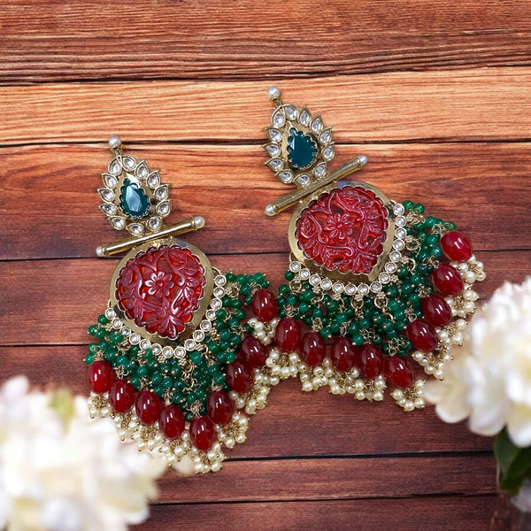 Indian Bridal Jewelry with high quality kundan, ruby green beads and pearls in gold plating.