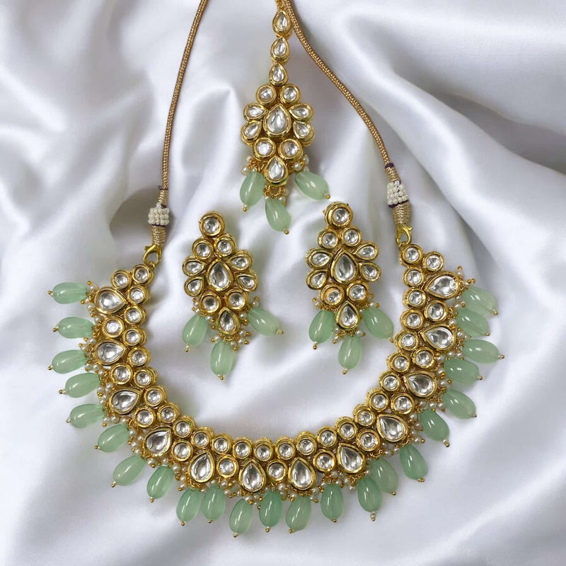 Premium quality mint Kundan necklace set featuring intricate back meenakari work. The set includes matching earrings and a maang tikka, perfect for traditional occasions. Ideal for Indian, Pakistani, and South Asian jewelry enthusiasts. Enhance your elegance with this stunning piece!




Premium quality mint Kundan necklace set featuring intricate back meenakari work. The set includes matching earrings and a maang tikka, perfect for traditional occasions. Ideal for Indian, Pakistani, and South Asian jewe


