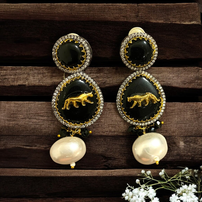 Designer-inspired earrings featuring black stone, baroque pearls, and a striking tiger motif. Intricate detailing makes them perfect for weddings,festive occasions,and traditional Indian wear.Elegant statement earrings for a luxurious, timeless look.