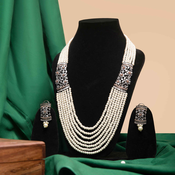 Multistranded Pearl Long Necklace with CZ Broaces on both sides with earrings featuring Desi Jewelry with CZ.
