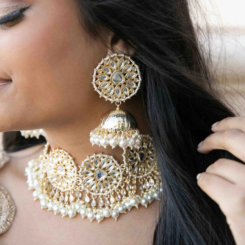 Model Wearing Gold Kundan Necklace Set with Jhumkas and Maang Tikka | Traditional Indian Bridal Look | Pakistani Wedding Jewelry | Ethnic South Asian Bridal Attire | Gold Plated Kundan Jewelry Set with Earrings and Maang Tikka | Elegant Bridal Fashion | Intricate Kundan Work with Gold Finish | Perfect for Weddings and Festive Occasions