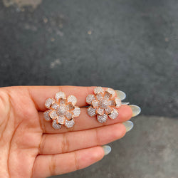 Our Rose Gold Rosira Cubic Zirconia Stud Earrings are delicate and subtle beauties. These high quality studs are handmade with high quality American Diamonds in the shape of a flower in rose gold finish. Perfect for any Indian, Pakistani and Western jewelry need.