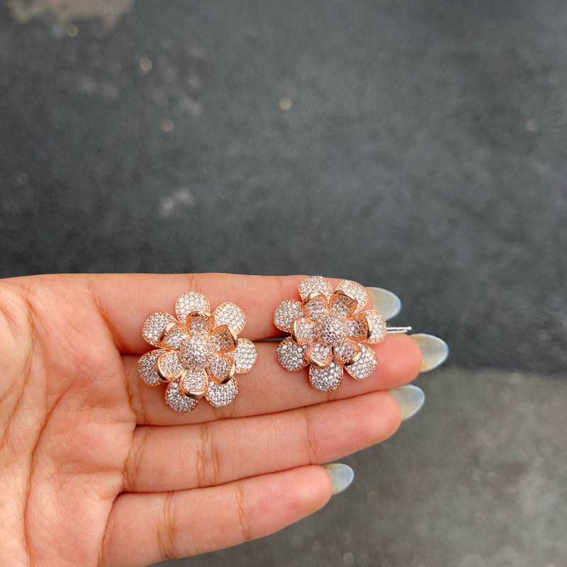 Our Rose Gold Rosira Cubic Zirconia Stud Earrings are delicate and subtle beauties. These high quality studs are handmade with high quality American Diamonds in the shape of a flower in rose gold finish. Perfect for any Indian, Pakistani and Western jewelry need.