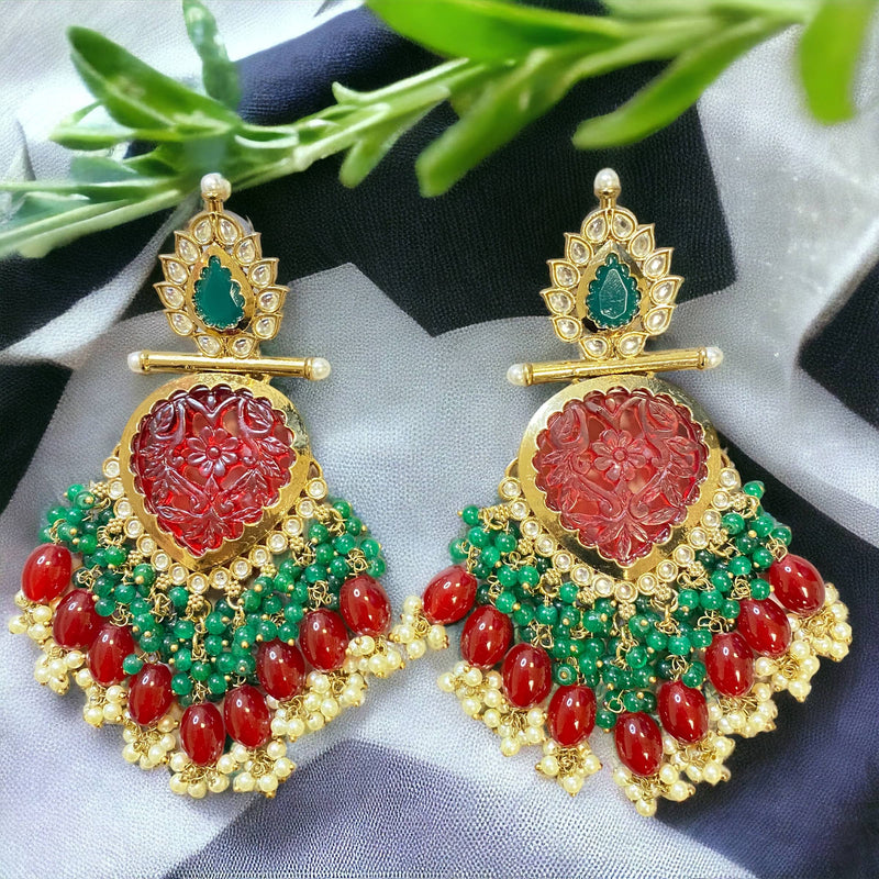 Indian Jewellery Online USA featuring ruby green beads with kundan and pearls in gold plating Indian earrings.