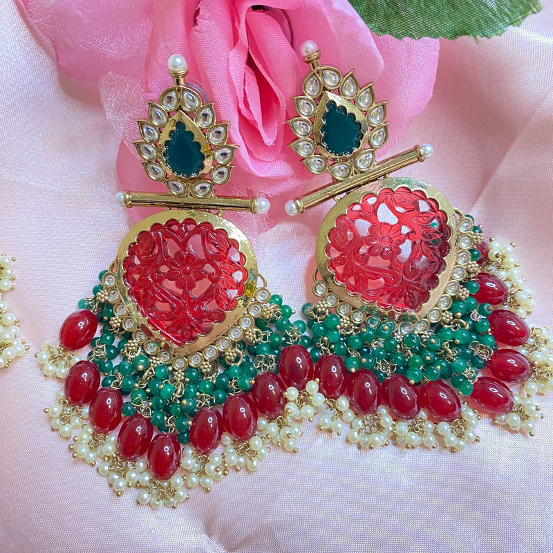 Indian Bridal Jewelry with high quality kundan, ruby green beads and pearls in gold plating.
