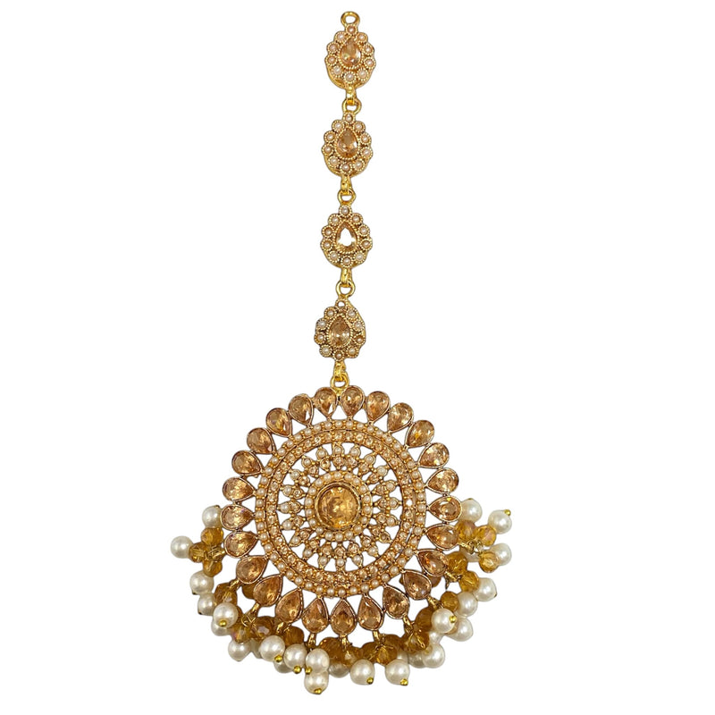 Champagne gold maang tikka with lustrous pearls | Intricately designed with a luxurious finish for a regal touch | Perfect for weddings, receptions, and festive occasions | A timeless South Asian bridal jewelry piece | Elegant design that complements sarees, lehengas, and ethnic outfits | Lightweight yet statement-worthy for a sophisticated look | Elevate your bridal ensemble with this exquisite pearl maang tikka, adding grace and charm to any traditional attire.