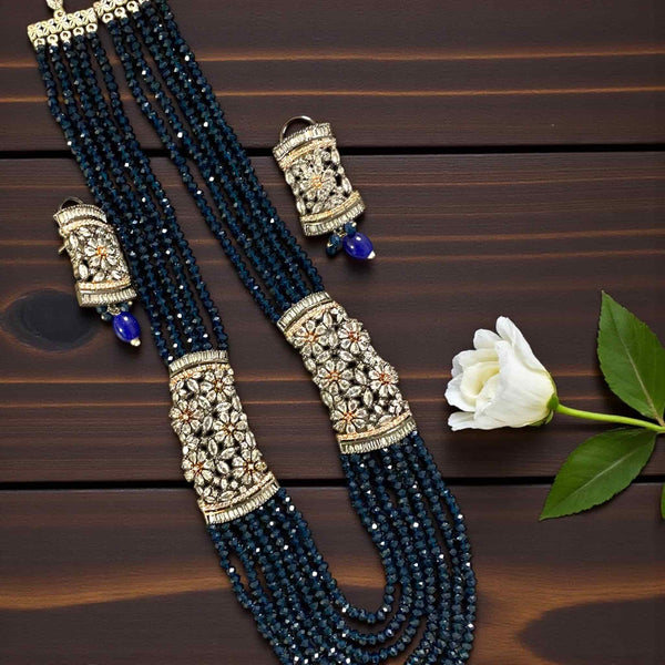 Blue Pearl Mahima CZ Long Necklace Set with CZ Flowers | Indian Jewelry | Elegant long necklace with blue pearls and sparkling cubic zirconia flowers in gold plating | Perfect for weddings, receptions, and festive occasions | Traditional yet modern Indian jewelry with matching earrings | Statement bridal necklace set by Romikas Jewelry | Timeless design blending cultural charm and contemporary elegance
