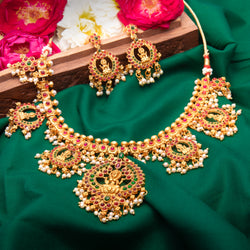 Necklace Set in gold with ruby and emerald stones and pearls. comes with earrings. perfect for Indian tradiditional jewelry.