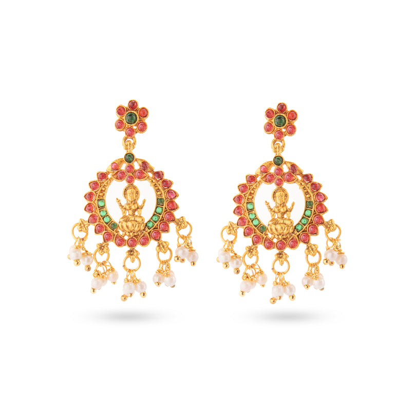 Traditional Golden earrings with lord lakshmi in ruby and green stones with hanging pearls.