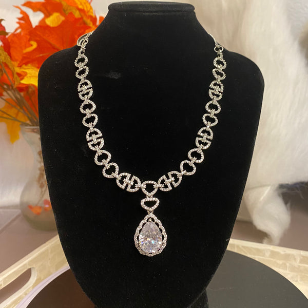 White CZ Necklace set with white stone in the pendant surrounded by intricate cubic zirconia.