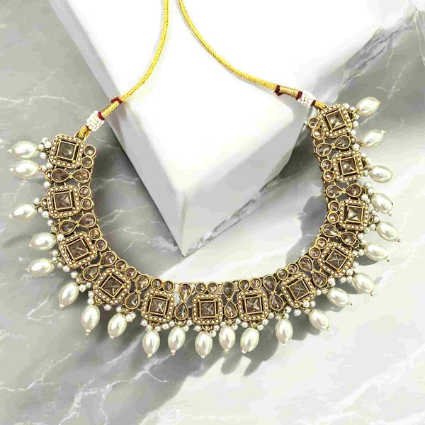 High-end Polki necklace with pearls in a traditional gold-plated finish, featuring intricate Kundan Polki work and luxurious pearl detailing. Elegant Indian bridal necklace perfect for South Asian weddings, festive occasions, and ethnic wear. Statement choker-style design ideal for Desi brides seeking timeless, regal jewelry. Handcrafted necklace showcasing fine craftsmanship and premium materials.