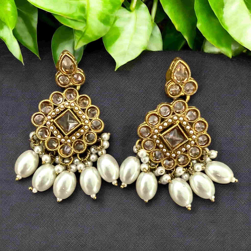 High-end Polki earrings with pearls, featuring intricate Kundan Polki work in a traditional gold-plated finish. Handcrafted for Indian brides and festive occasions, these statement earrings are perfect for South Asian weddings and ethnic wear. Elegant pearl detailing adds a touch of luxury and sophistication, making them ideal for Desi bridal looks and cultural celebrations. Timeless design with exquisite craftsmanship.