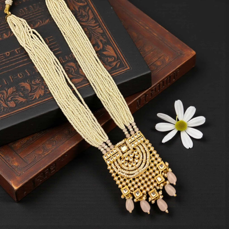 Long pearl necklace with multi-layer pearl strands, intricate Kundan work, and soft pink Monalisa stones. Elegant Indian bridal necklace perfect for weddings, festivals, and special events. The detailed Kundan pendant adds a luxurious traditional touch to sarees, lehengas, and party outfits.